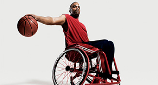 Image of Man in a wheelchair playing basketball